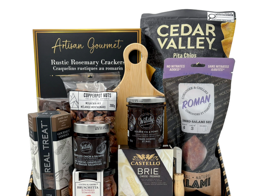 Assorted gourmet food items including crackers, chips, and meats with visible branding on a white background. Gift basket idea in Calgary.