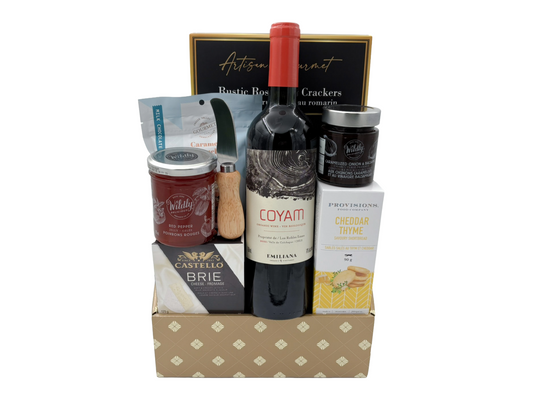 wine and gourmet snacks in a gift box on a white background